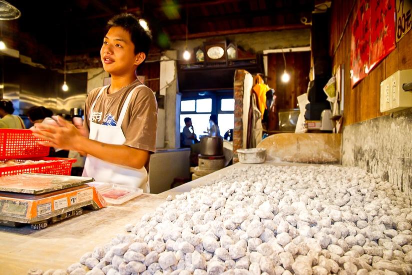 A young Taiwanese man making taro balls, one of the best foods in Jiufen