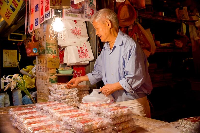 An elderly vendor at Lai Ah Po Taro Balls on Jiufen Old Street